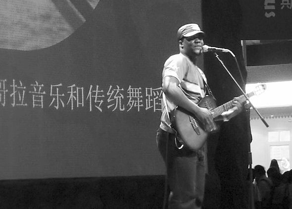 Gelson, a singer from Angola, performing in the African Pavilion at the World Expo